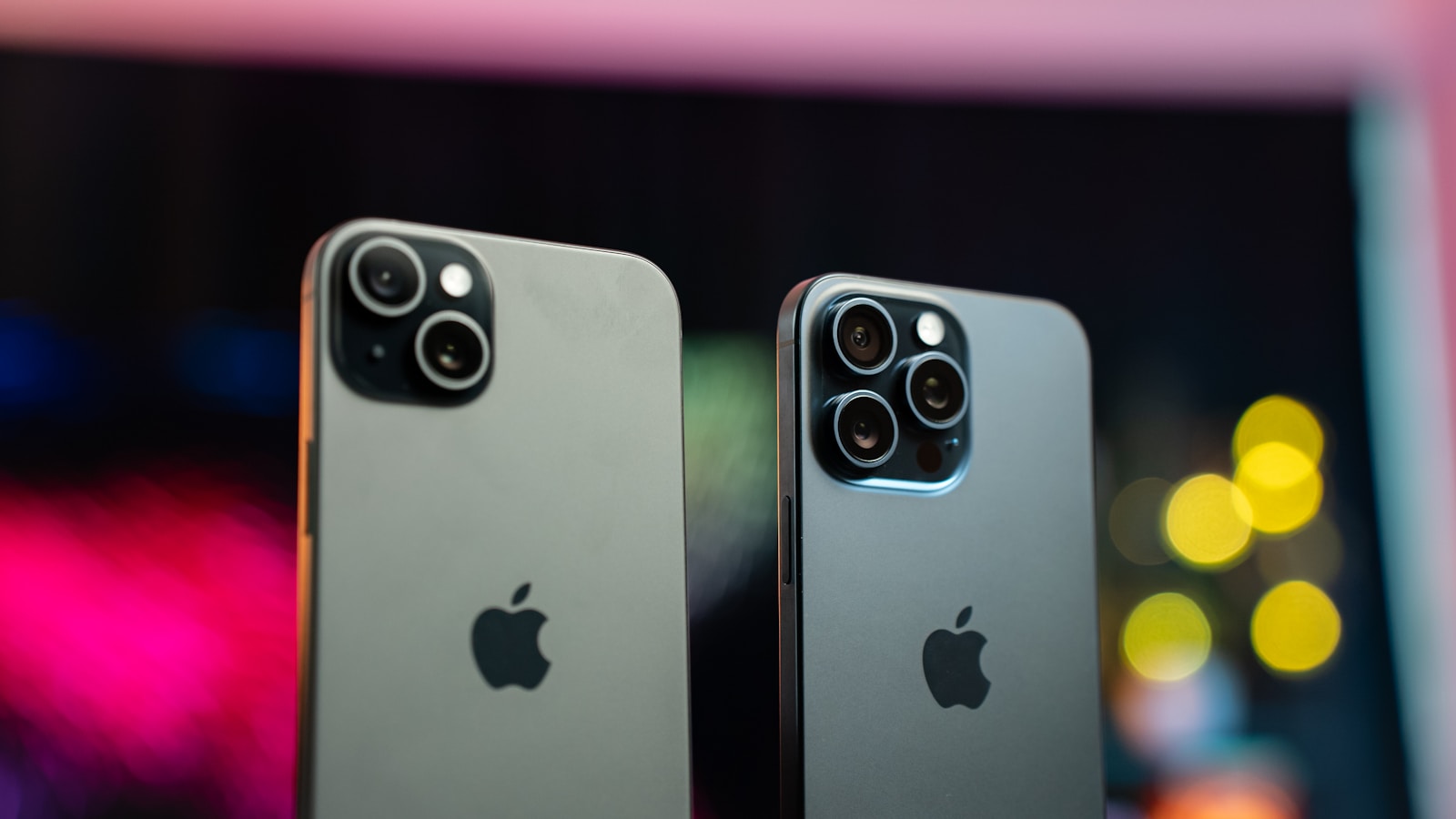 Two iPhones placed side-by-side on a table — visual cue for an A/B comparison between two screenshot variants